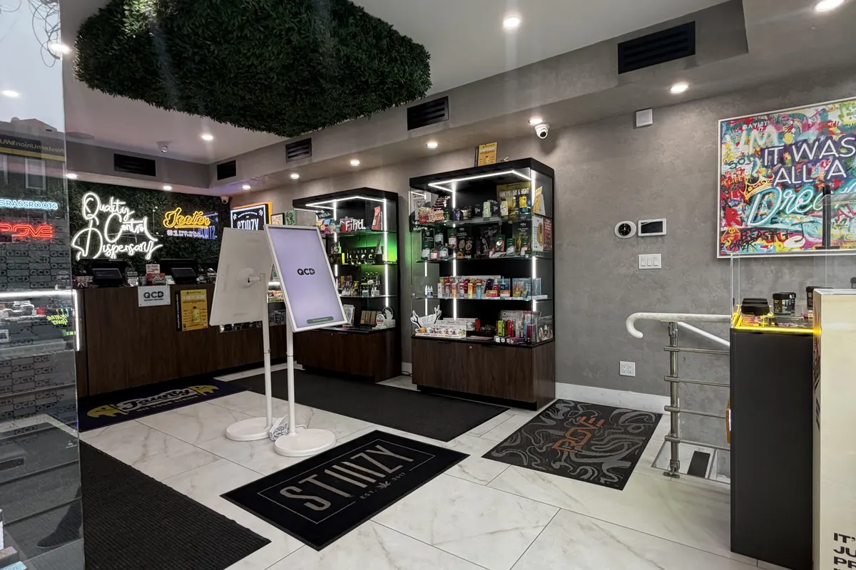 QCD dispensary interior with green moss ceiling